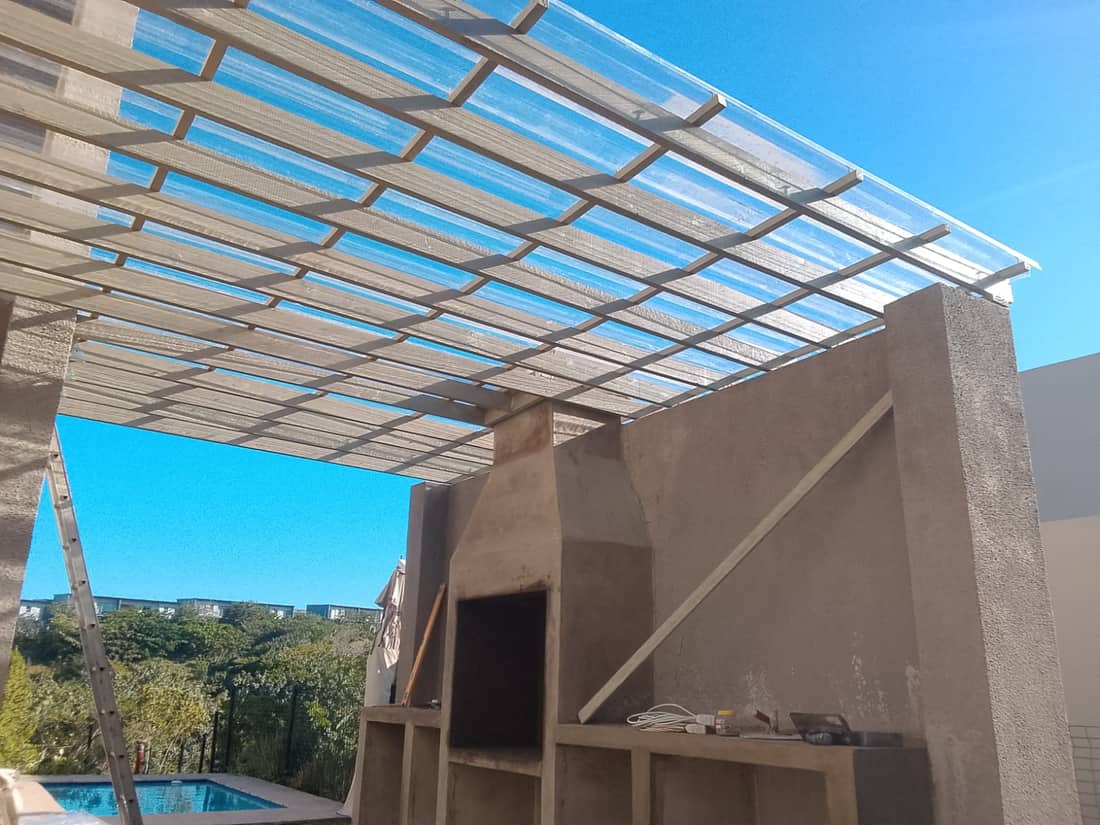 Covered patio roof structure and braai area
